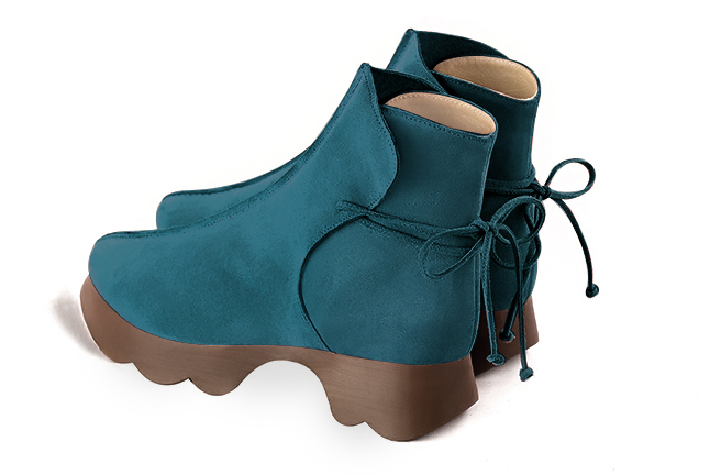 Peacock blue women's ankle boots with laces at the back. Round toe. Low rubber soles. Rear view - Florence KOOIJMAN